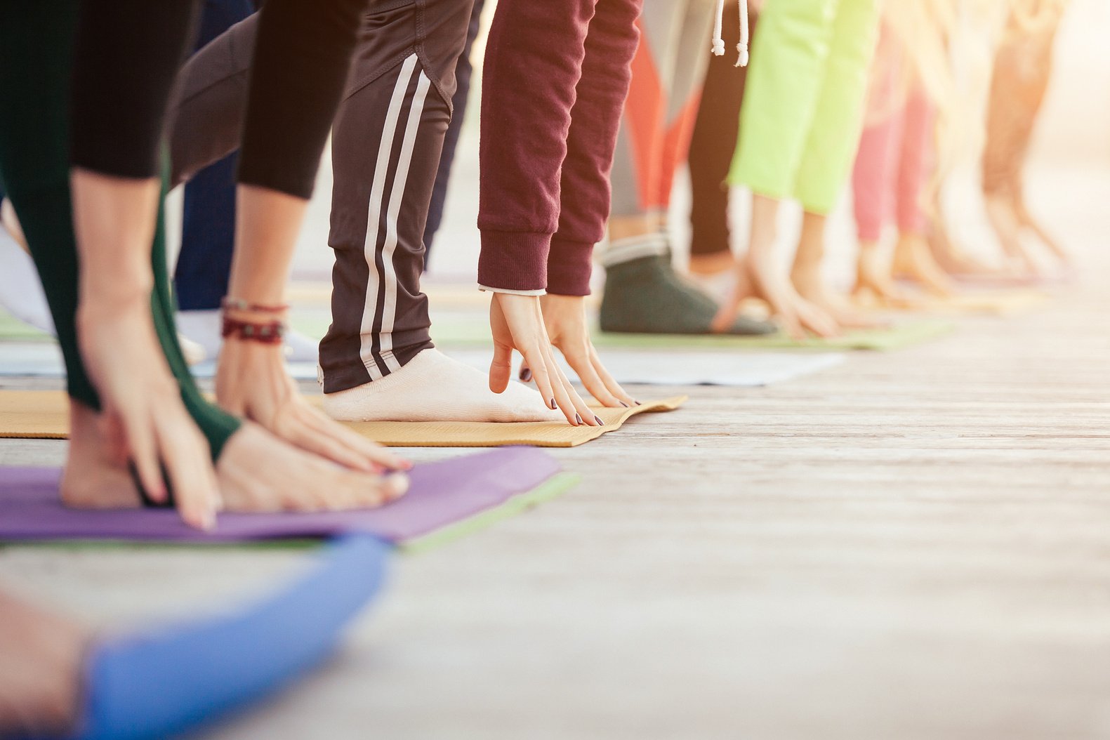 Yoga group concept. Sporty young people practicing morning yoga